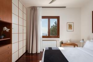 Ένα ή περισσότερα κρεβάτια σε δωμάτιο στο Villa Valli Athenian Riviera +42 φωτογραφίες