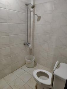 a bathroom with a toilet and a shower at 2 Bedrooms Standard Apartment Islamabad-HS Apartments in Islamabad