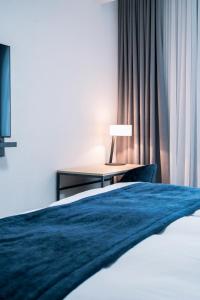Rúm í herbergi á YParc Hôtel