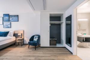Rúm í herbergi á YParc Hôtel