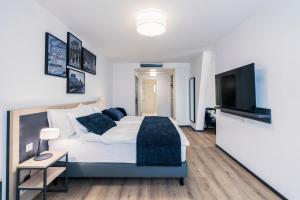 Rúm í herbergi á YParc Hôtel