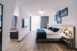 Rúm í herbergi á YParc Hôtel