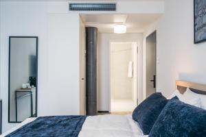 Rúm í herbergi á YParc Hôtel