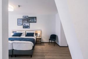 Rúm í herbergi á YParc Hôtel