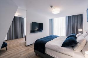 Rúm í herbergi á YParc Hôtel