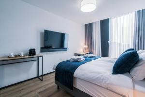 Rúm í herbergi á YParc Hôtel