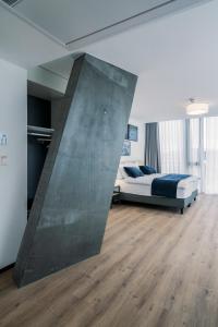 Rúm í herbergi á YParc Hôtel