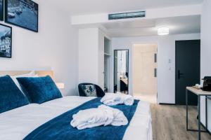 Rúm í herbergi á YParc Hôtel