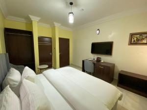 TV o dispositivi per l'intrattenimento presso MOK Apartments & Suites