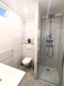 a bathroom with a shower and a toilet at Entre calanques et vieux port ! in La Ciotat