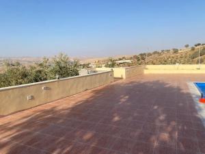 a roof top with a view of the desert at Amman landscape farm in Amman