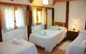 Posteľ alebo postele v izbe v ubytovaní Barraca típica del Delta, con piscina, jardín y barbacoa - Deltavacaciones