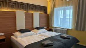 Letto o letti in una camera di Hotel Pod Vlekem