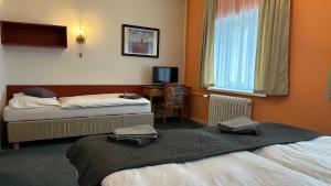 Letto o letti in una camera di Hotel Pod Vlekem