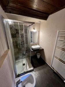 a bathroom with a shower and a sink at La casa sul fiume in Oulx