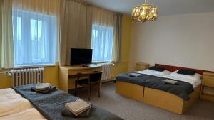 Letto o letti in una camera di Hotel Pod Vlekem