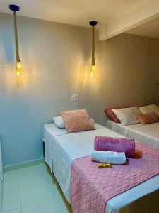 Ένα ή περισσότερα κρεβάτια σε δωμάτιο στο Residencial Temporada Aracaju