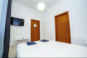 Posteľ alebo postele v izbe v ubytovaní Atlas Hotel