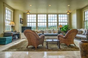 a living room with two chairs and a couch at Adams Hill House Retreat - Artist-Architect's Estate, Newfane Vermont in Newfane