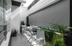a dining room with tables and chairs and plants at ESCALA BUSINESS HOTEL in Chiclayo