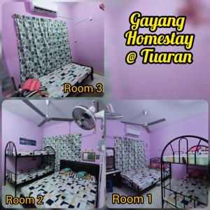a room with two bunk beds in a pink room at Gayang Tuaran in Tuaran
