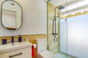 a bathroom with a sink and a shower at Villa Alvarito by Villa Plus in Puerto Calero +10 photos
