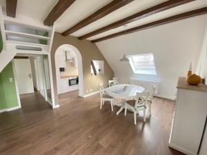 a kitchen and dining room with a table and chairs at Dagmar 120qm 3 Schlafzimmer Wellness in Olsberg