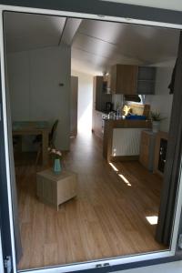 a view of a kitchen and a living room at Ferienhaus Leipzig am Schladitzer See in Rackwitz