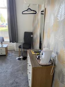 TV a/nebo společenská místnost v ubytování Belhaven Private Hotel