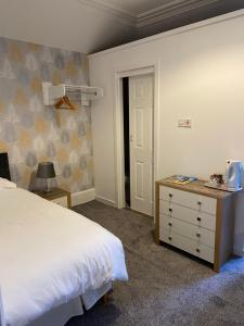 Postel nebo postele na pokoji v ubytování Belhaven Private Hotel