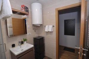 A bathroom at Lux Apartman "Gold" - Cacak