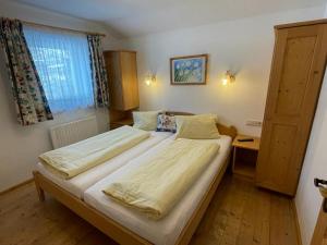 Postel nebo postele na pokoji v ubytování Landhaus Brandner