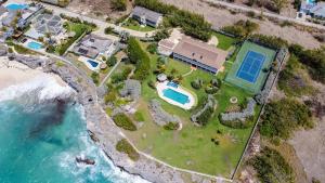 an aerial view of a house on the beach at Belair Great House - The stunning, private escape with breathtaking views and exquisite surroundings. in Saint Philip