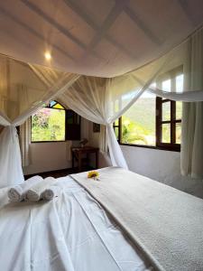 Cama ou camas em um quarto em Pousada do Capão Chapada Diamantina mais 37 fotos