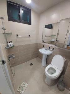 a bathroom with a toilet and a sink at 29 Play House in Incheon
