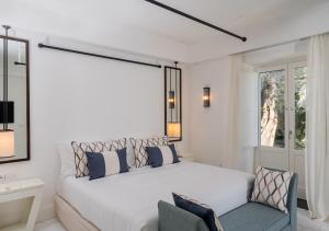 Postel nebo postele na pokoji v ubytování Furore Grand Hotel