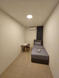 Postel nebo postele na pokoji v ubytování SS HOSTEL PENANG