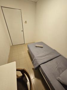 Postel nebo postele na pokoji v ubytování SS HOSTEL PENANG