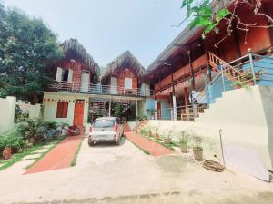 a car parked in front of a building at Your home Mai Chau in Mai Chau