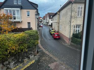 a view from a window of a street with cars at Monteurunterkunft Zum Mohr in Birstein