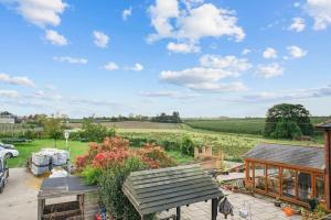 a view of a garden from a house at Orchard View in Ash