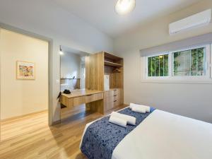 Una cama o camas en una habitación de KASO - Fotomara