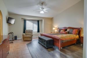 a bedroom with a bed and a ceiling fan at Pet-Friendly Peoria Home Near State Farm Stadium! in Peoria