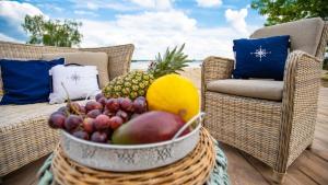 a bowl of fruit in a basket on a patio at Relax place & restaurant in Zegrze Południowe