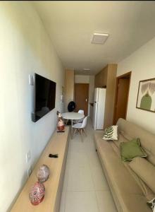 TV a/nebo společenská místnost v ubytování Flat no Mana Beach Experience