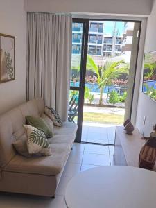 Posezení v ubytování Flat no Mana Beach Experience