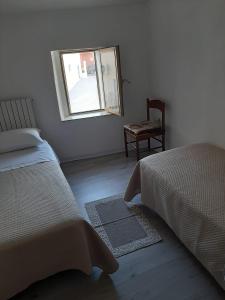 Llit o llits en una habitació de Casa Vacanze Dante