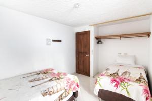 Postel nebo postele na pokoji v ubytování Fami Hotel Vive Jardin