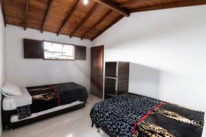 Postel nebo postele na pokoji v ubytování Fami Hotel Vive Jardin