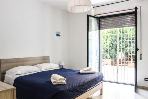 Un pat sau paturi într-o cameră la Apulian Sunset